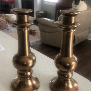 Set of two elements shiny bronze candle holders
